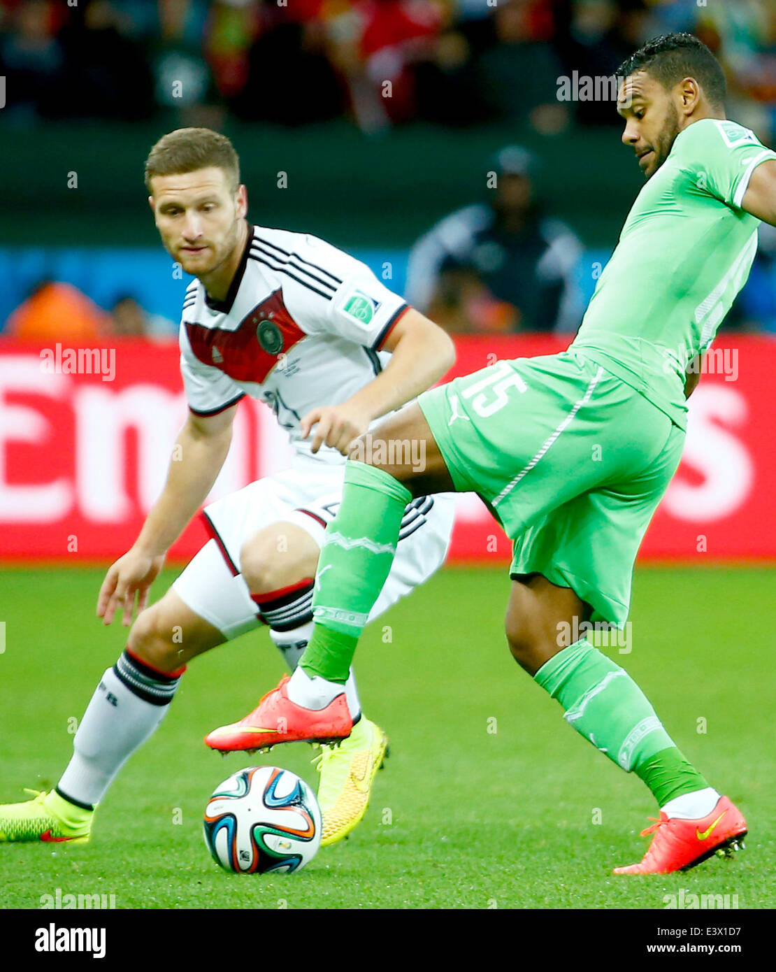 Porto Alegre, Brazil. 30th June, 2014. Germany's Shkodran Mustafi vies with Algeria's Hilal Soudani during a Round of 16 match between Germany and Algeria of 2014 FIFA World Cup at the Estadio Beira-Rio Stadium in Porto Alegre, Brazil, on June 30, 2014. Credit:  Chen Jianli/Xinhua/Alamy Live News Stock Photo