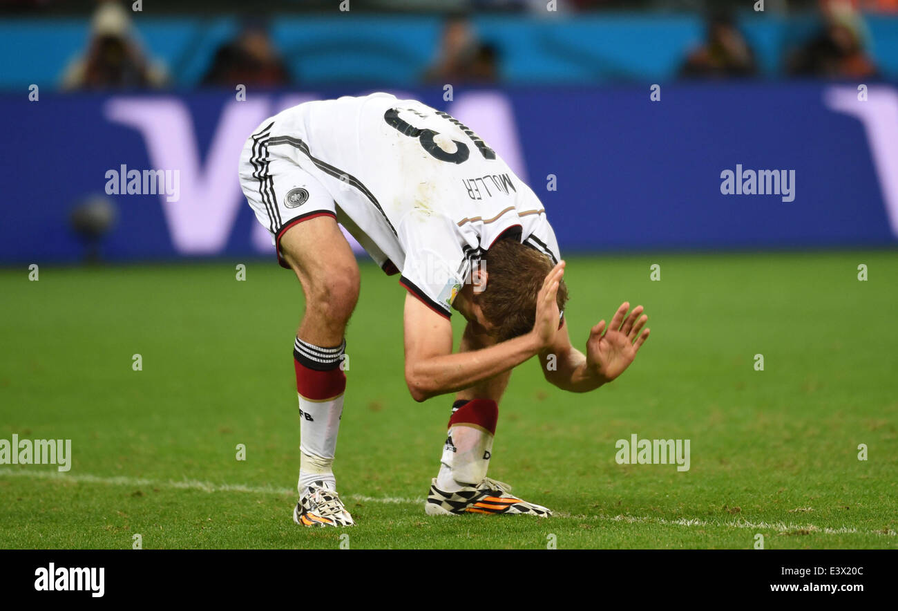Porto Alegre, Brazil. 30th June, 2014. Germany's Thomas Muller reacts after missing a chance during a Round of 16 match between Germany and Algeria of 2014 FIFA World Cup at the Estadio Beira-Rio Stadium in Porto Alegre, Brazil, on June 30, 2014. Credit:  Li Ga/Xinhua/Alamy Live News Stock Photo
