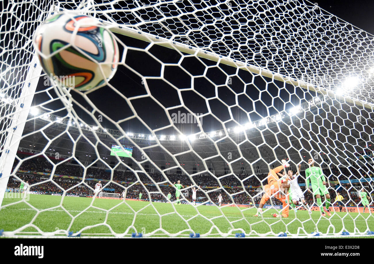 Porto Alegre, Brazil. 30th June, 2014. Germany's Andre Schuerrle (not pictured) scores the 1-0 against Algeria's Rais Mbolhi during the FIFA World Cup 2014 round of 16 soccer match between Germany and Algeria at the Estadio Beira-Rio in Porto Alegre, Brazil, 30 June 2014. Photo: Marcus Brandt/dpa/Alamy Live News Stock Photo