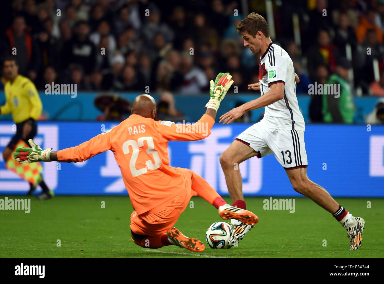 Porto Alegre, Brazil. 30th June, 2014. Germany's Thomas Muller (R) vies with Algeria's goalkeeper Rais Mbolhi during a Round of 16 match between Germany and Algeria of 2014 FIFA World Cup at the Estadio Beira-Rio Stadium in Porto Alegre, Brazil, on June 30, 2014. Germany won 2-1 over Algeria after 120 minutes and qualified for quarter-finals on Monday. Credit:  Li Ga/Xinhua/Alamy Live News Stock Photo