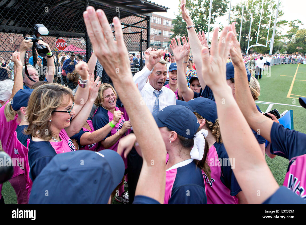 US House Speaker John Boehner joins the republican Congresswomen for a pre-game rally prior to the Congressional Women’s Softball game at Watkins Recreation Center June 18, 2014 in Washington, DC. Stock Photo