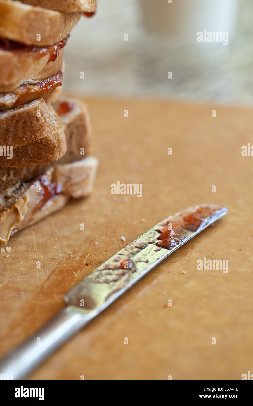 Stack of peanut butter and jelly sandwiches and knife Stock Photo Alamy