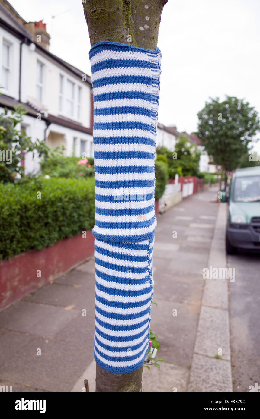 Yarn bombing around a tree, London, England, UK Stock Photo