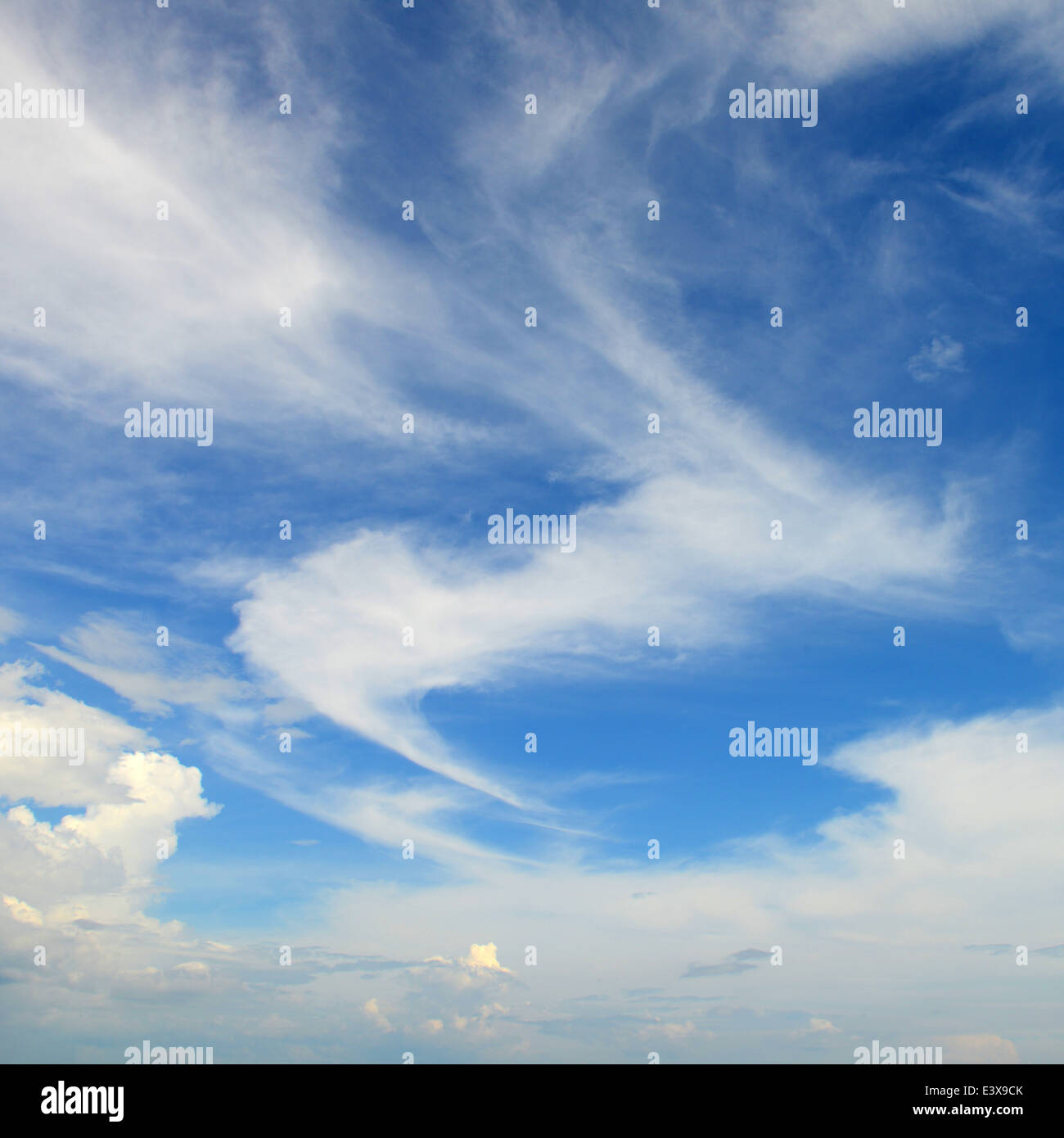 The blue sky and white fluffy clouds Stock Photo - Alamy