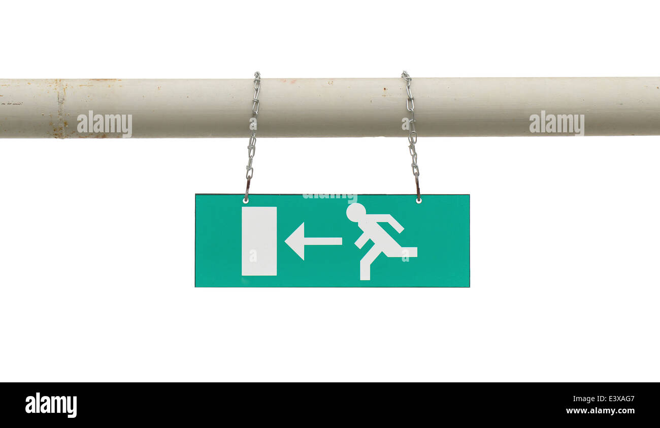 Green emergency exit sign hanging on an old metal pole Stock Photo