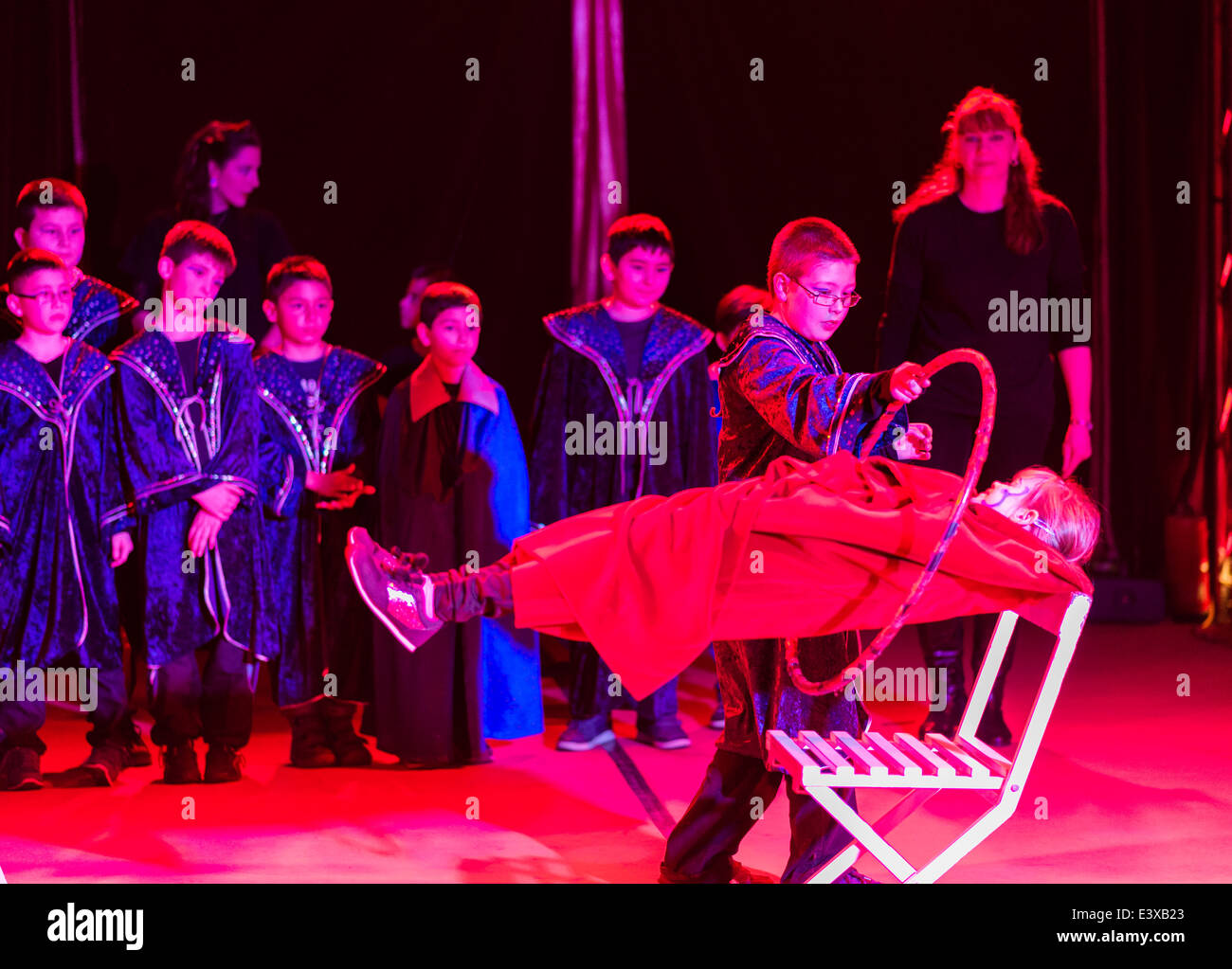 Primary school children perform a circus show in a circus tent after a week of practice with the circus artists. Stock Photo