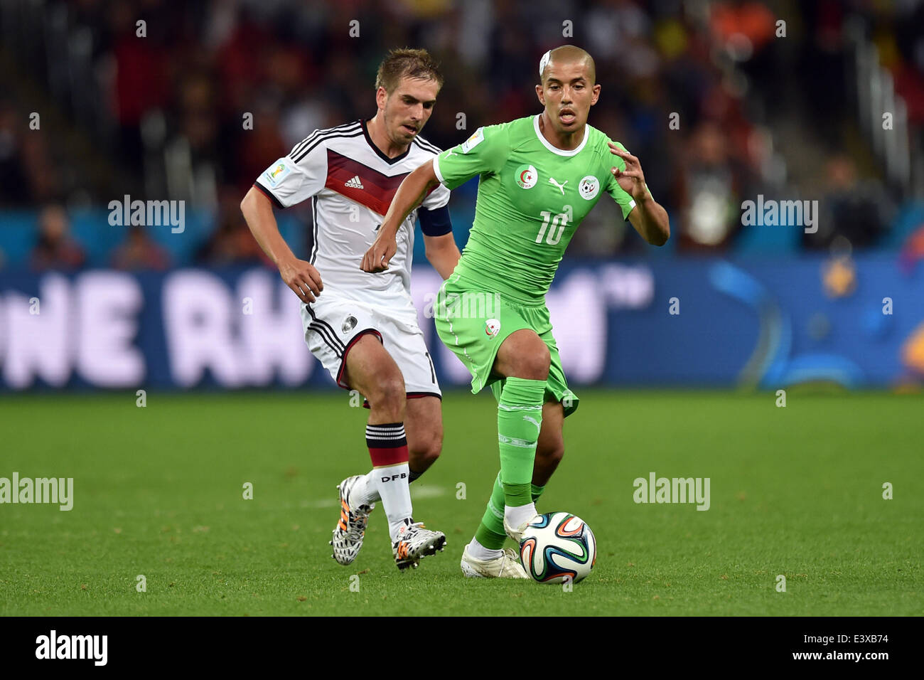 Porto Alegre, Brazil. 30th June, 2014. PORTO ALEGRE, 30.06.2014: BRAZIL: Philipp Lahm and Feghouli in match between Germany and Algeria, corresponding to the round of the last 16 of the World Cup 2014, played at the Beira Rio stadium in Porto Alegre, June 30, 2014 Photo:. Edu Andrade/Urbanandsport/Nurphoto. © Edu Andrade/NurPhoto/ZUMAPRESS.com/Alamy Live News Stock Photo