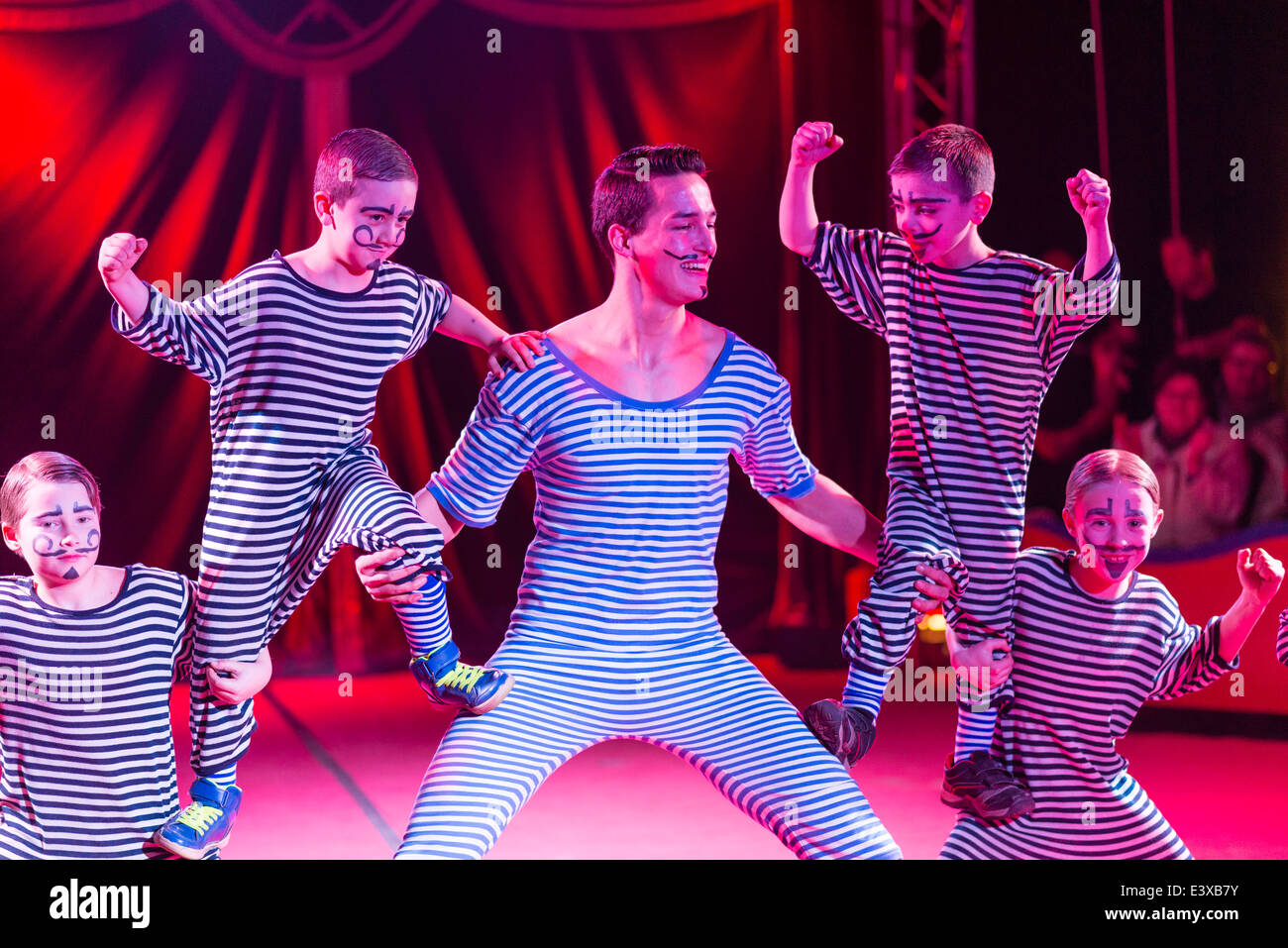 Primary school children perform a circus show in a circus tent after a week of practice with the circus artists. Stock Photo