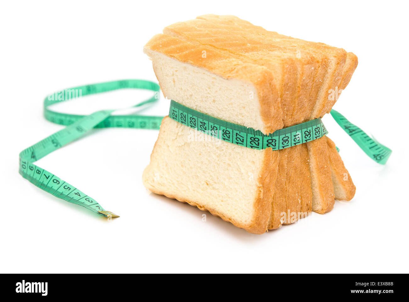 bread grasped by measuring tape Stock Photo