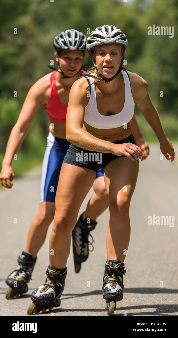 Young women, 19 years, inline skating, country road, Schurwald, Baden-Württemberg, Germany Stock Photo
