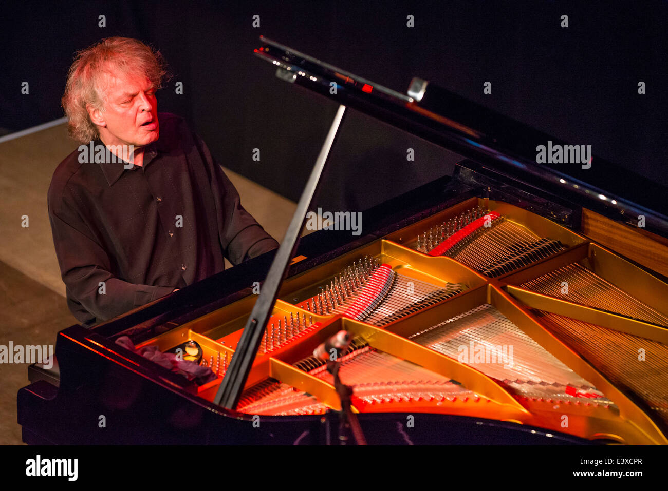 Jazz pianist Joachim Kühn plays a solo concert. Stock Photo