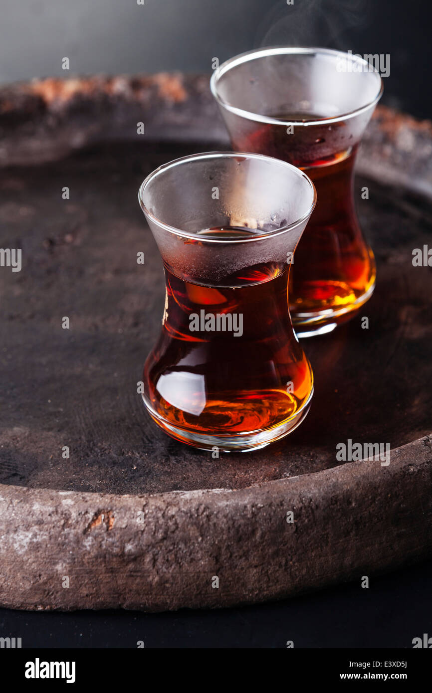 Hot tea in Turkish tea cup on dark background Stock Photo