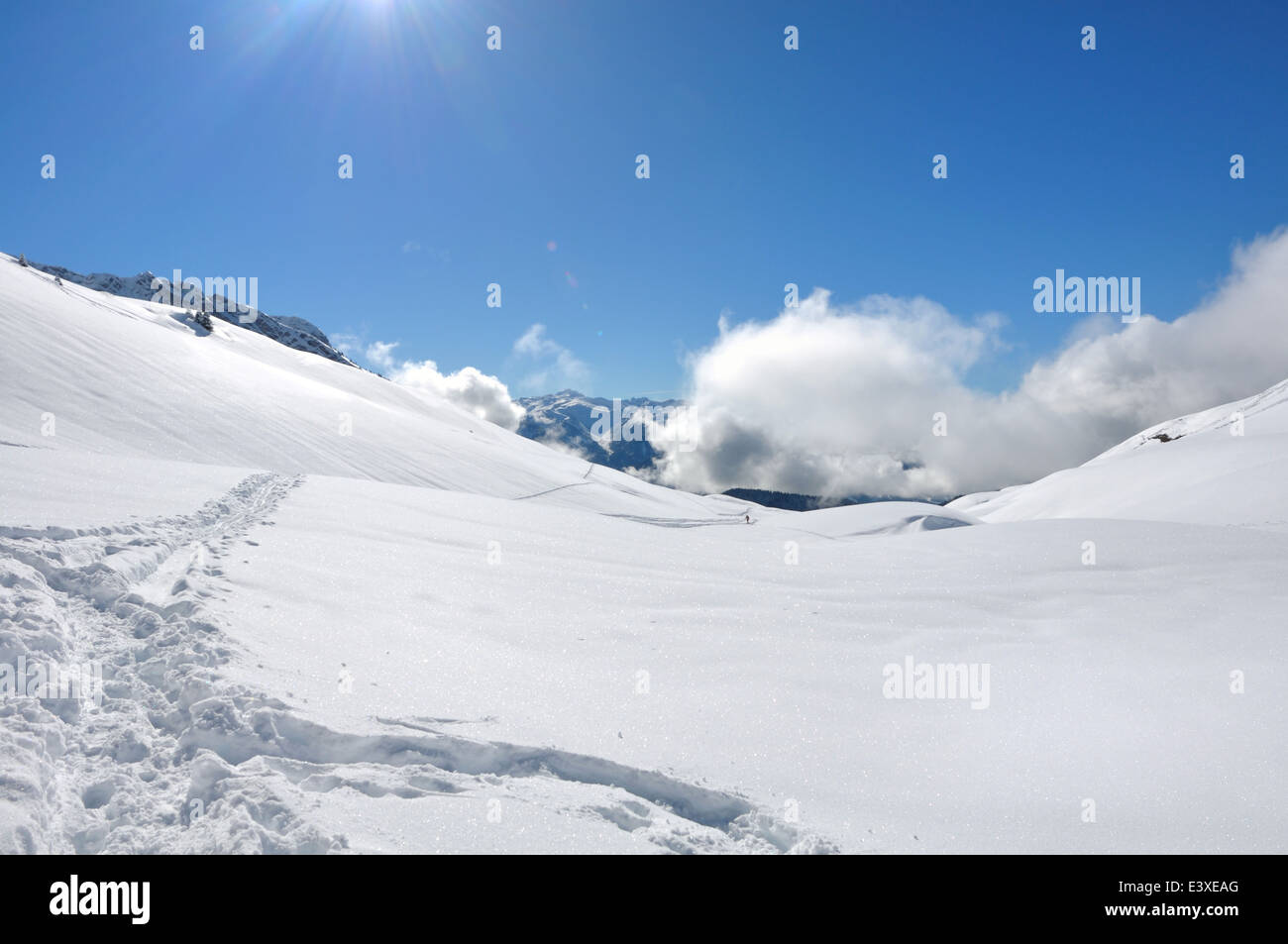 snowy mountain landscape under blue sky with white clouds Stock Photo ...