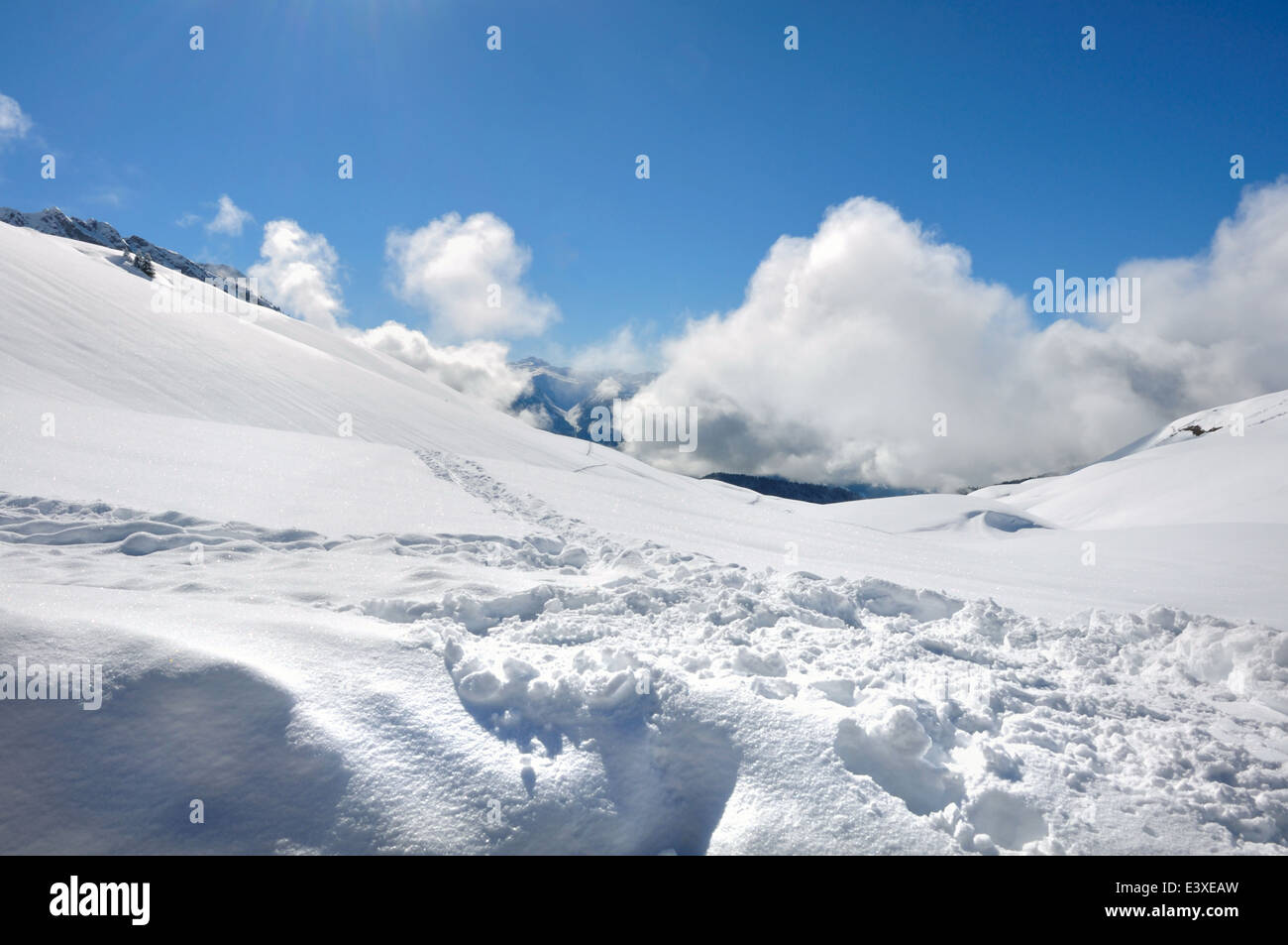 snowy mountain landscape under blue sky with white clouds Stock Photo ...