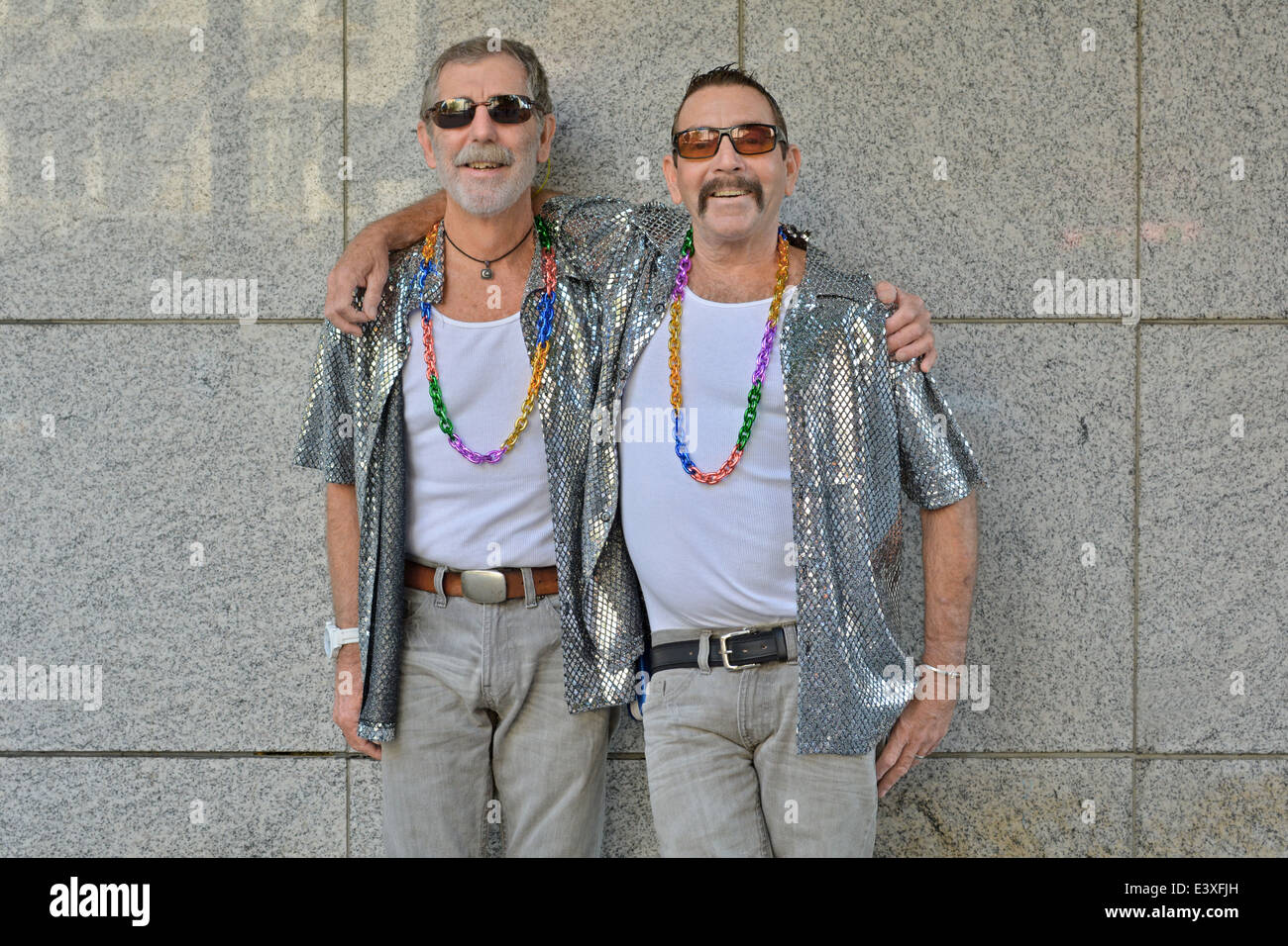 Portrait of a gay couple from Hawaii who've been together for over 35 years. On the way to NYC Gay Pride Parade. Stock Photo
