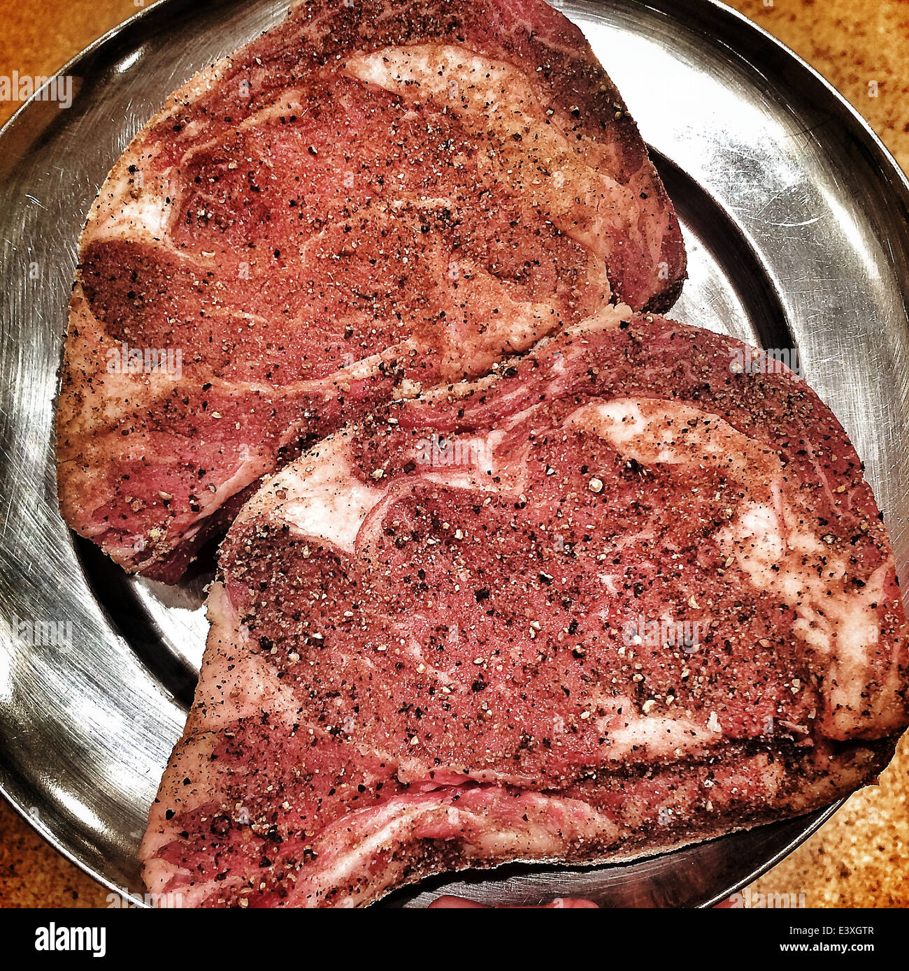 Plate of seasoned steaks - Smartphone Captured Stock Image