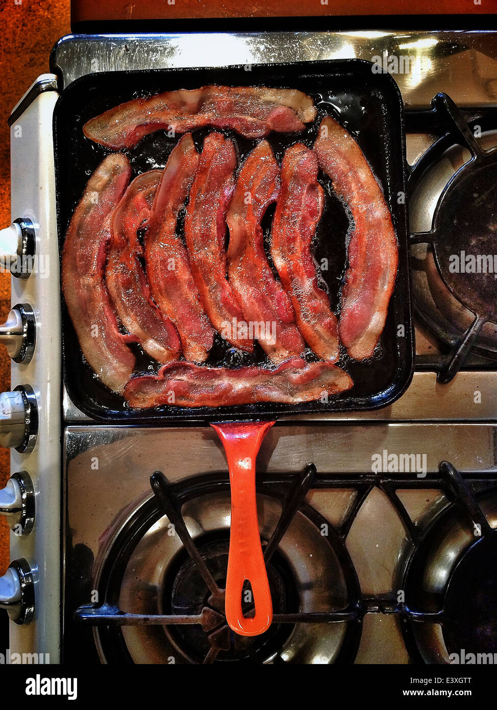 Bacon frying in pan - Smartphone Captured Stock Image