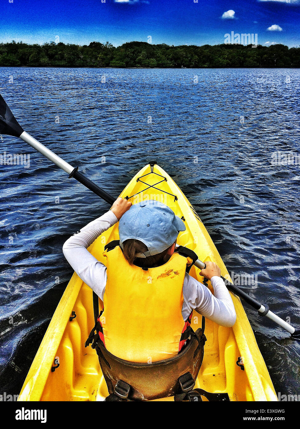 Boy kayaking in rural lake Stock Photo - Alamy