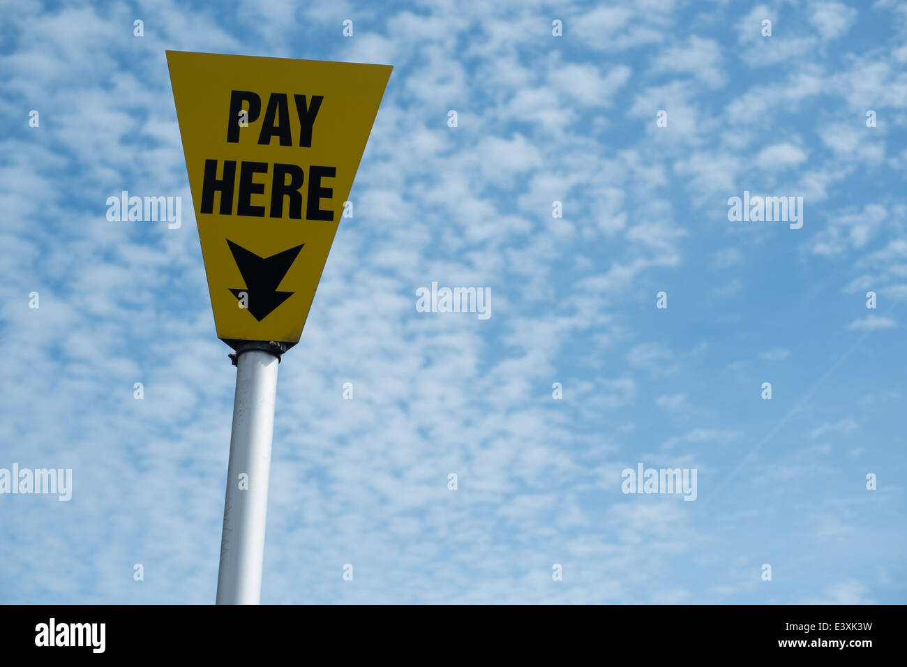 pay here sign and clouds Stock Photo