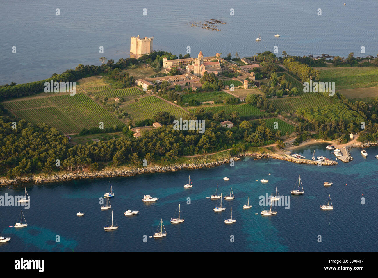 AERIAL VIEW. Lérins Abbey and Saint-Honorat Fortress. Saint-Honorat Island, Lérins Islands, Cannes, Alpes-Maritimes, French Riviera, France. Stock Photo