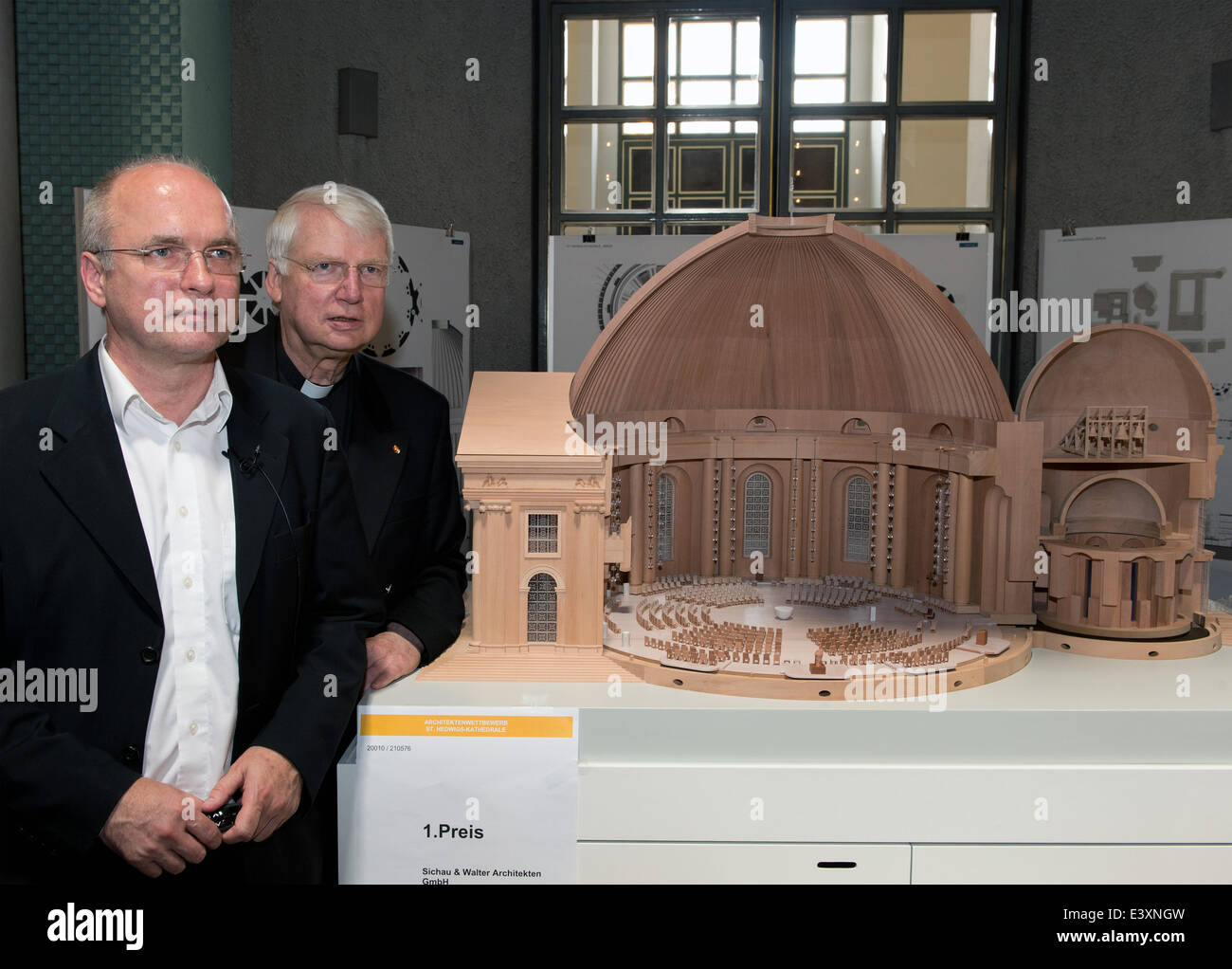 Berlin, Germany. 1st July, 2014. Prelate Ronald Rother and architect Peter Sichau (L) stand next to the winning design for the redesign of the interior of St. Hedwig's Cathedral by architect's office Sichau und Walter (Fulda) in Berlin, Germany, 01 July 2014. The winning design plans to close off the lower church, amongst other things. Photo: SOEREN STACHE/DPA/Alamy Live News Stock Photo