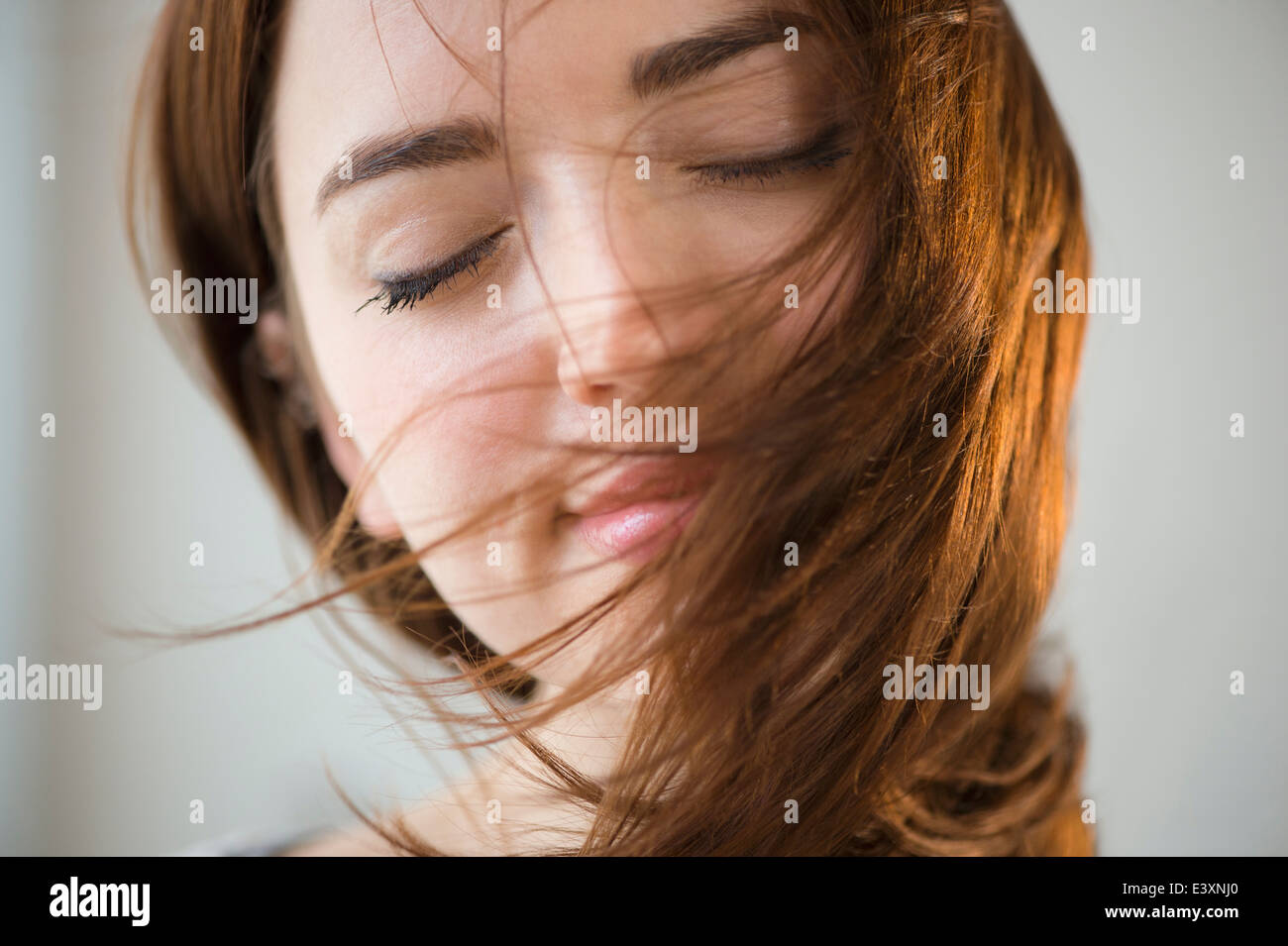 Woman's hair blowing in wind Stock Photo