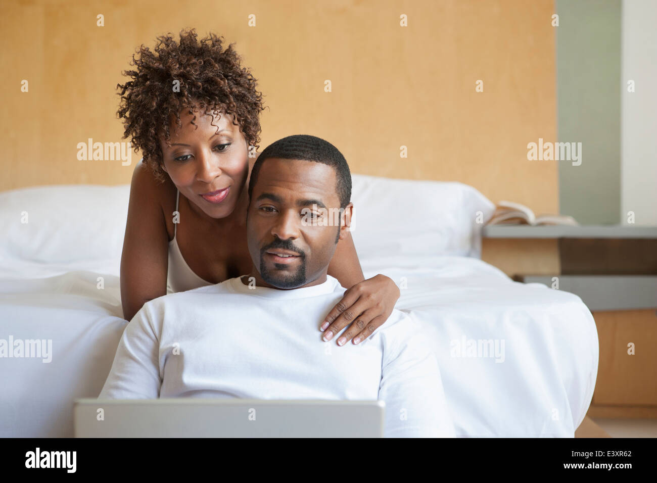 African American couple using laptop Stock Photo - Alamy