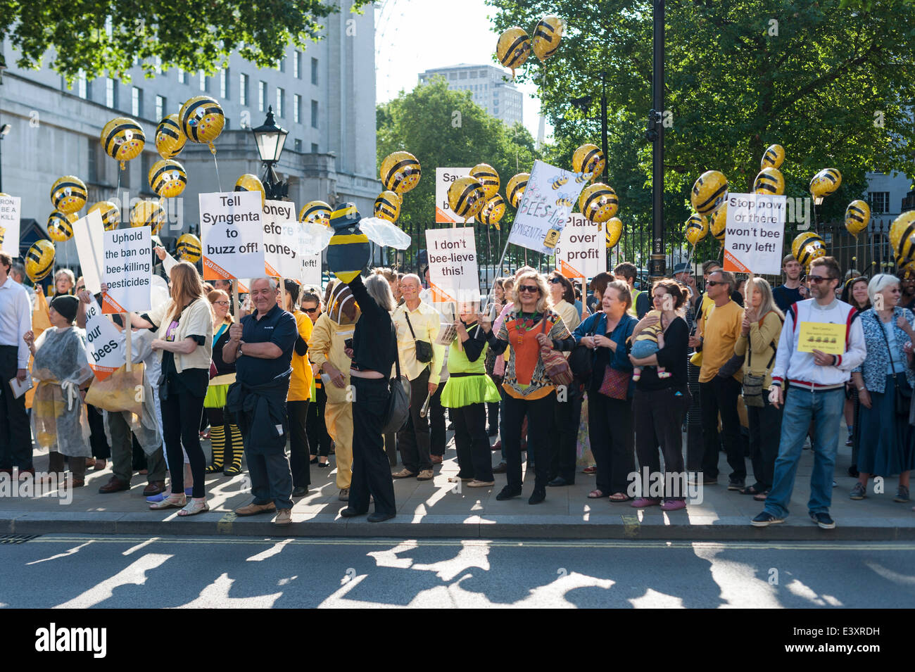 Whitehall, London, UK. 1st July 2014. A large crown of “38 Degrees” activists joined a host of campaign organisations to demonstrate on Downing Street in London. British PM David Cameron was meeting his cabinet to decide whether to allow banned bee killing pesticides to be used on fields across the UK. Recently, Syngenta made an emergency appeal after their product was banned across Europe last year due to the perceived risk it poses to bees. Credit:  Lee Thomas/Alamy Live News Stock Photo