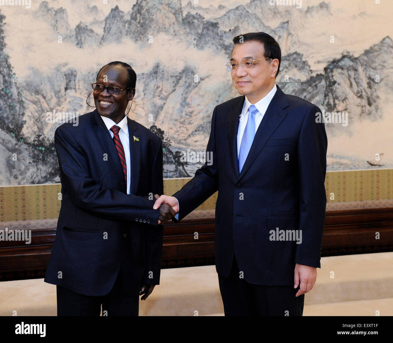 Beijing, China. 1st July, 2014. Chinese Premier Li Keqiang (R) meets with South Sudanese Vice President James Wani Igga, who is also deputy chairman of the Sudan People's Liberation Movement (SPLM), in Beijing, capital of China, July 1, 2014. Credit:  Zhang Duo/Xinhua/Alamy Live News Stock Photo