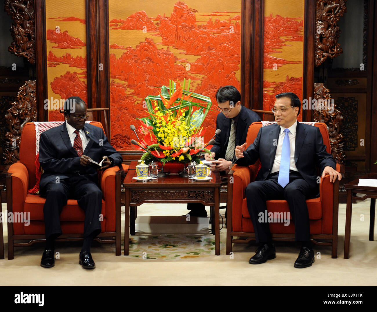 Beijing, China. 1st July, 2014. Chinese Premier Li Keqiang (R) meets with South Sudanese Vice President James Wani Igga, who is also deputy chairman of the Sudan People's Liberation Movement (SPLM), in Beijing, capital of China, July 1, 2014. Credit:  Zhang Duo/Xinhua/Alamy Live News Stock Photo