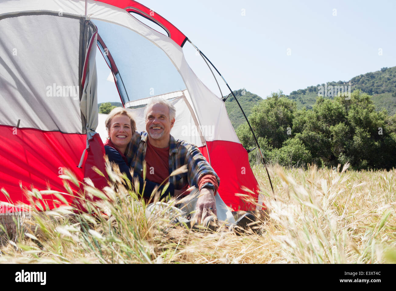 Senior Caucasian couple relaxing at campsite Stock Photo - Alamy