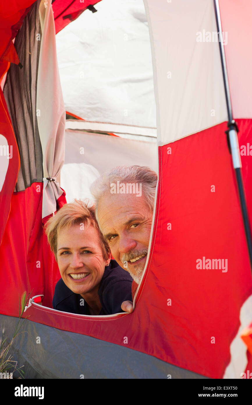 Senior Caucasian couple relaxing in tent Stock Photo - Alamy