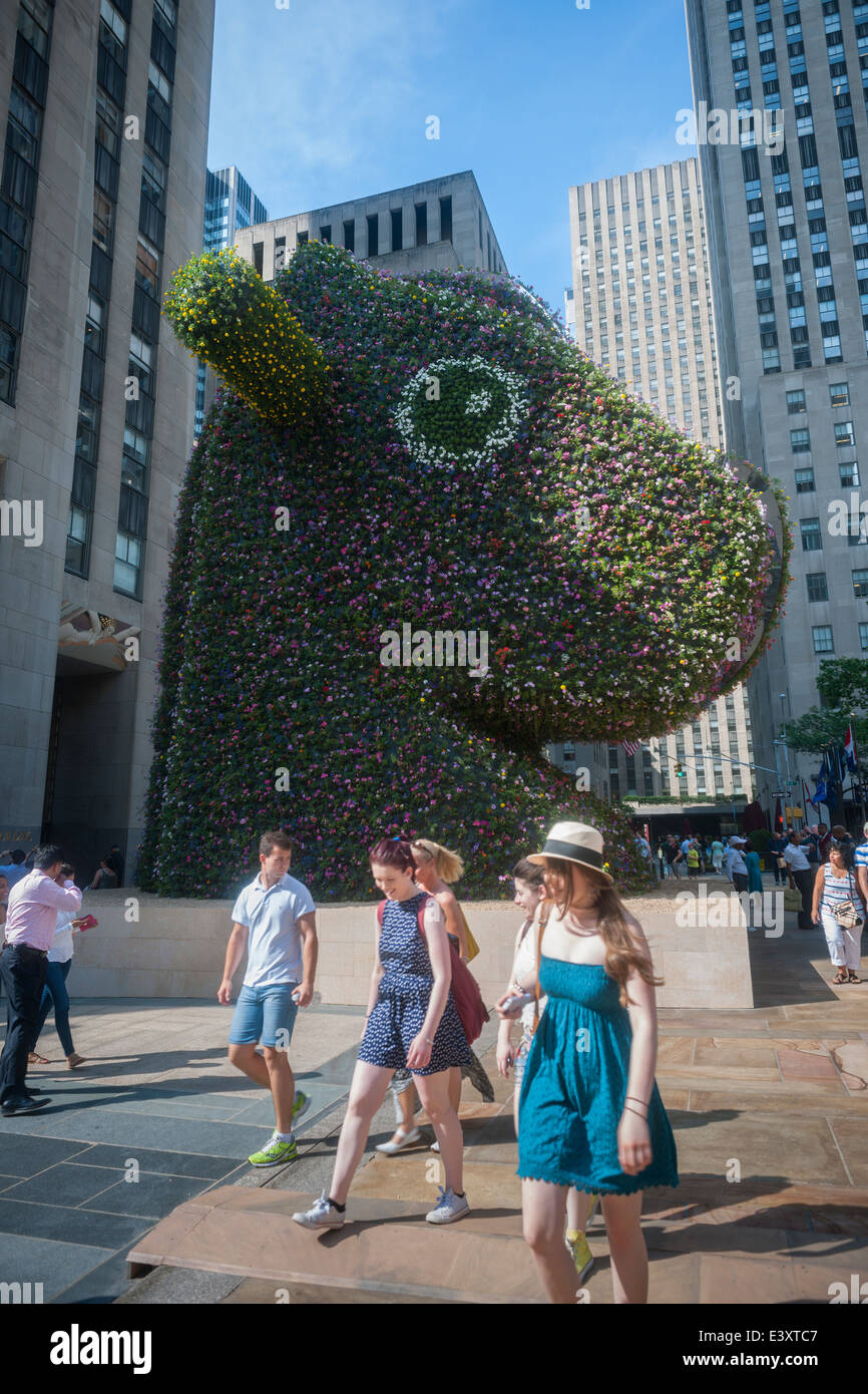 Visitors observe Jeff Koons' sculpture 'Split-Rocker' unveiled in Rockefeller Plaza in New York Stock Photo