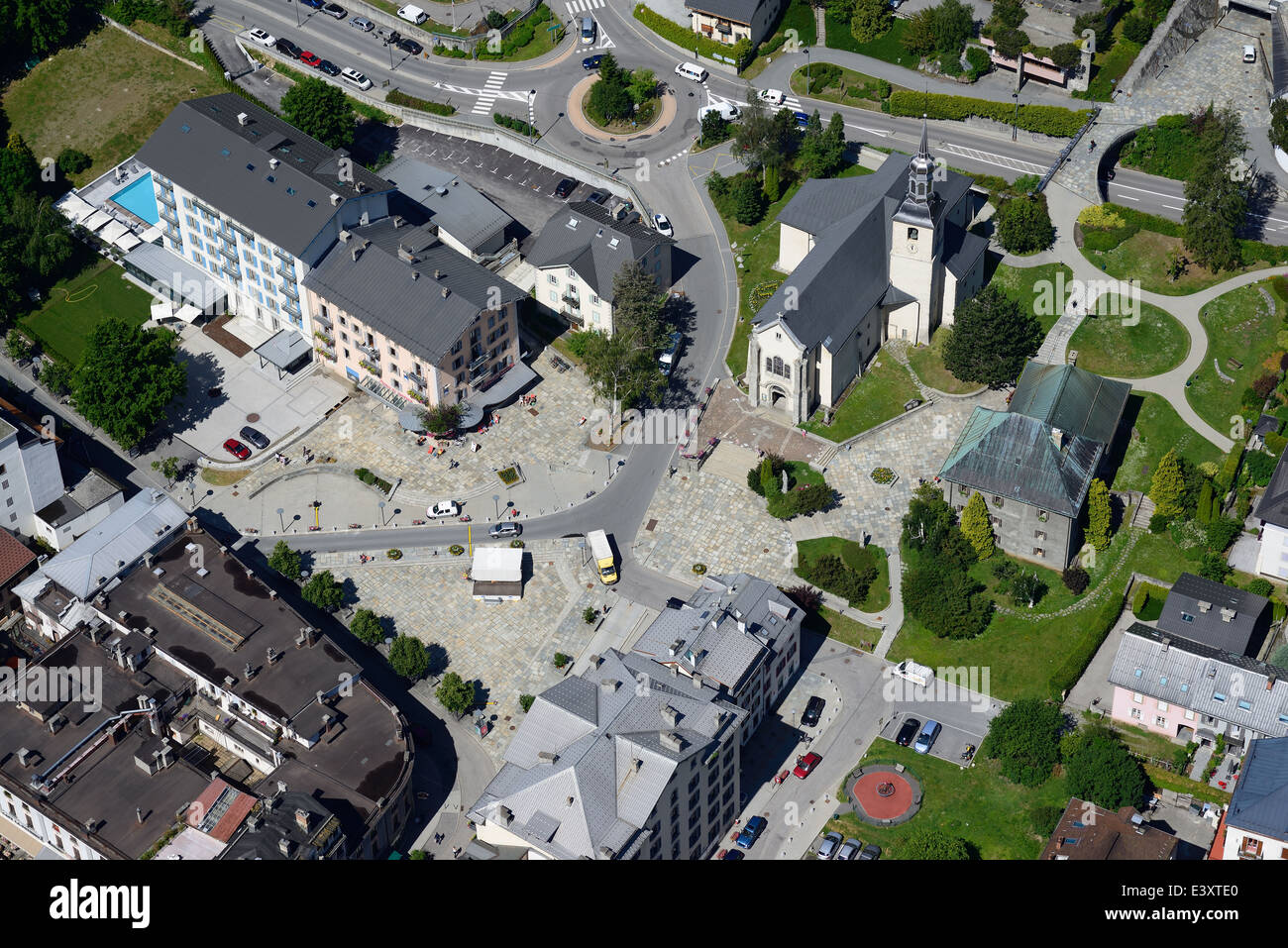 AERIAL VIEW. Church Plaza with the Catholic Parish of Saint-Bernard. Chamonix Mont-Blanc, Haute-Savoie, Auvergne-Rhône-Alpes, France. Stock Photo