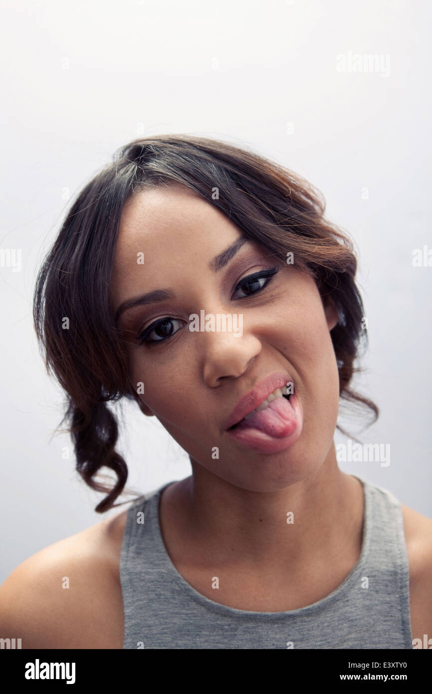 Close up of woman sticking out tongue Stock Photo