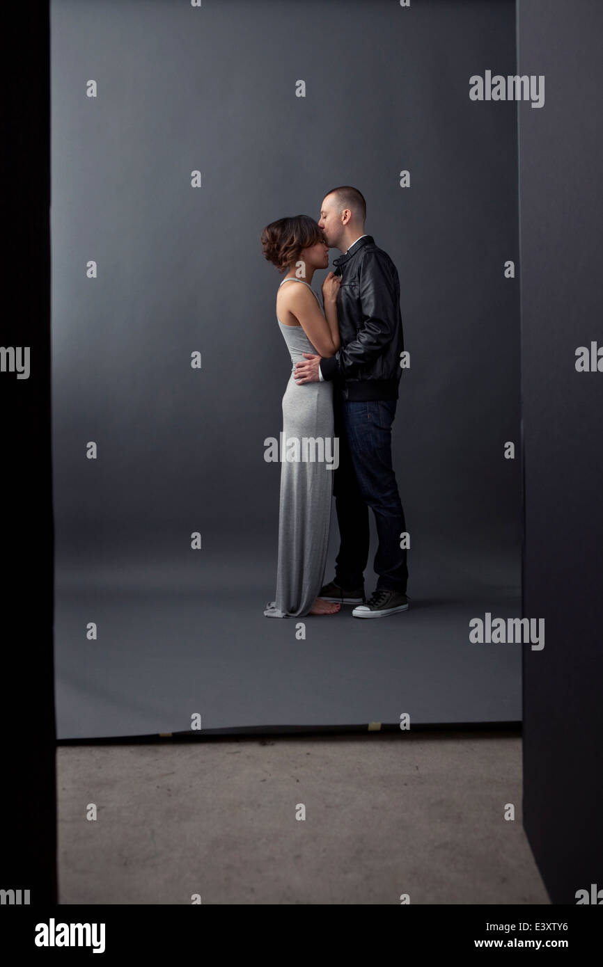 Couple kissing in studio Stock Photo