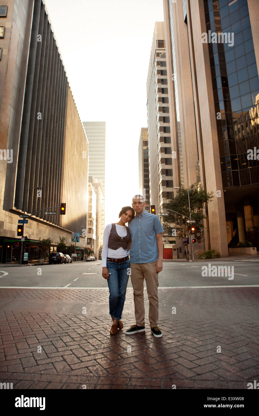 Couple standing on city street Stock Photo