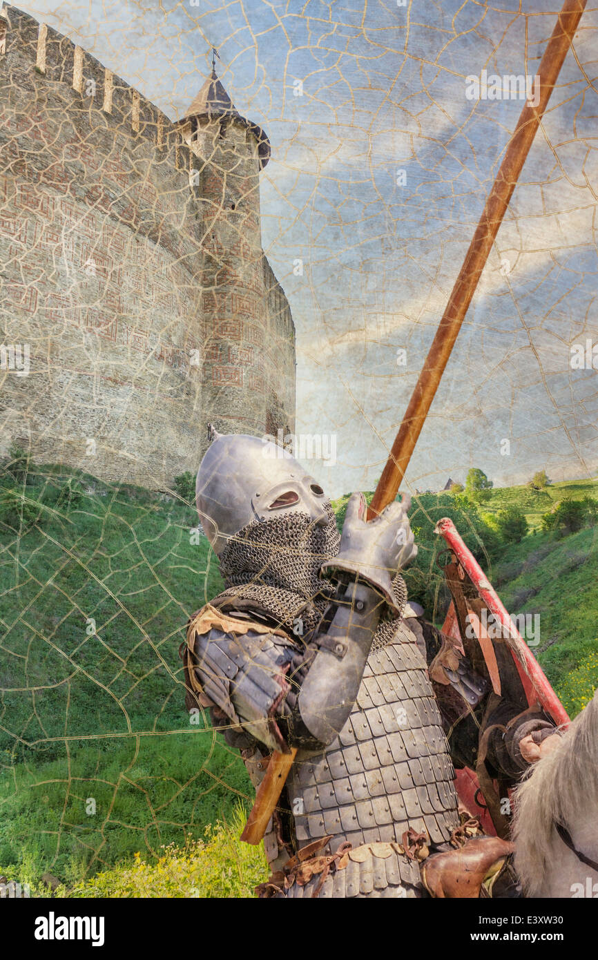 Armored knight on warhorse over old medieval castle (fortress) Stock Photo