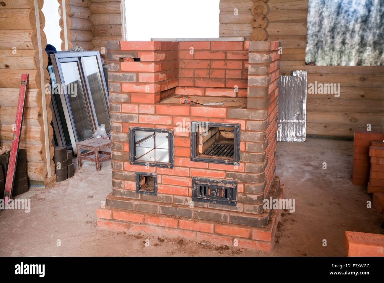 COSY decorating letters against a rustic brick wall above a wood burning  stove Stock Photo - Alamy