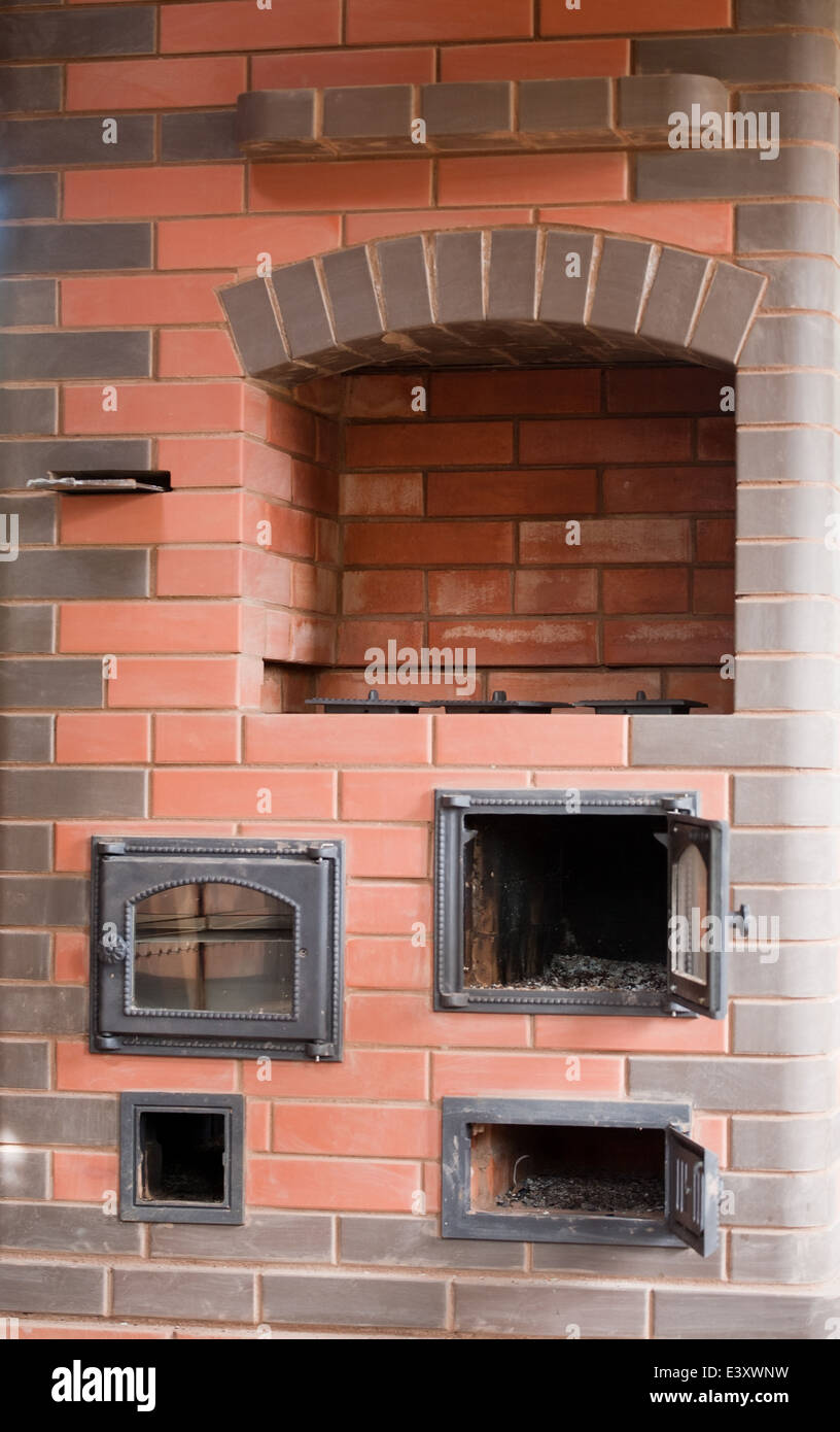 Brick Facade Closeup Of Big House Stove With Metal Doors And Stock