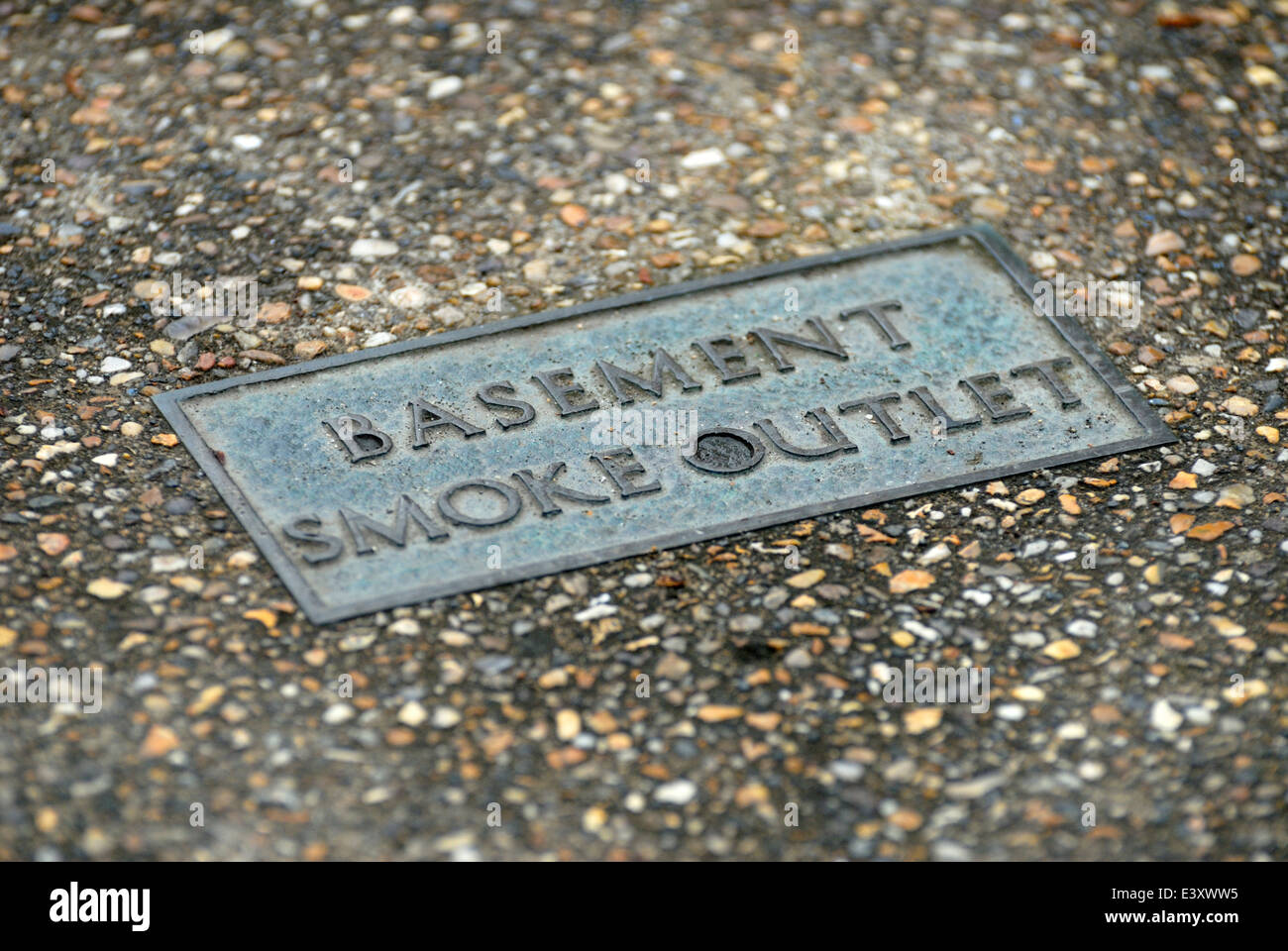 London, England, UK. Basement smoke outlet in the pavement (smoke vent