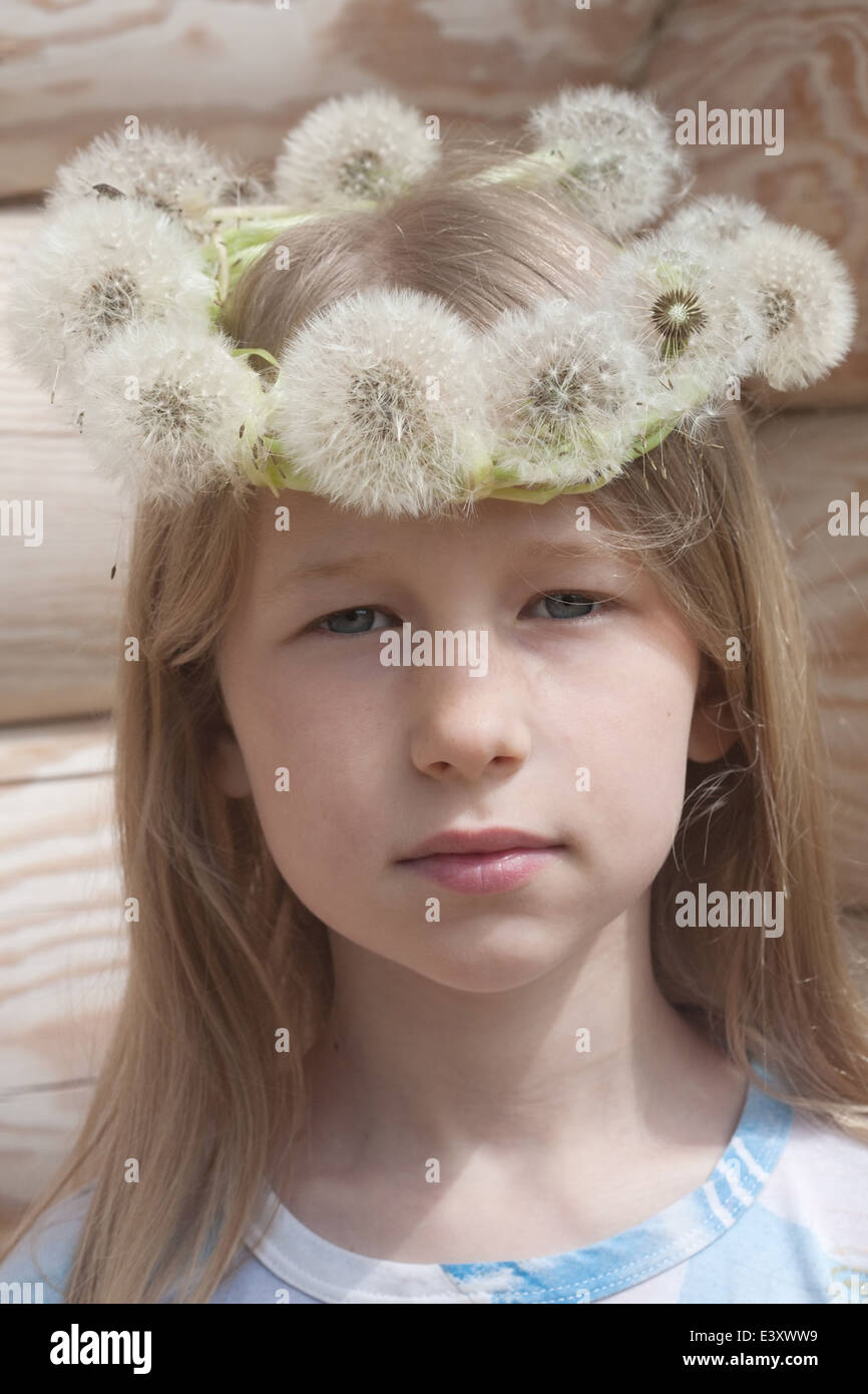 portrait of little caucasian girl in white dandelion garland Stock ...