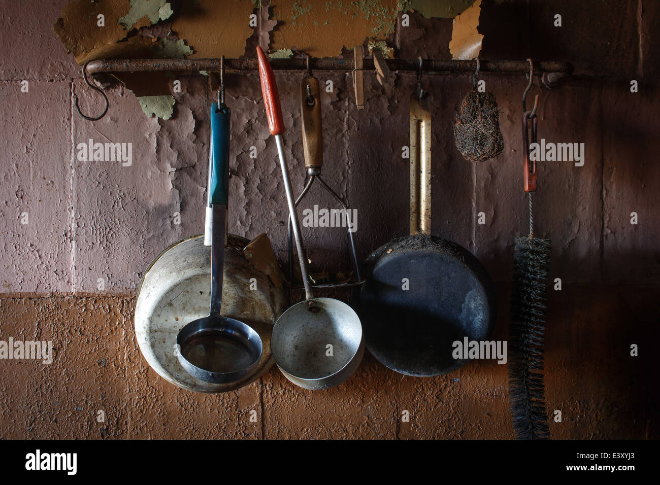 Vintage kitchen instruments haning on wall Stock Photo
