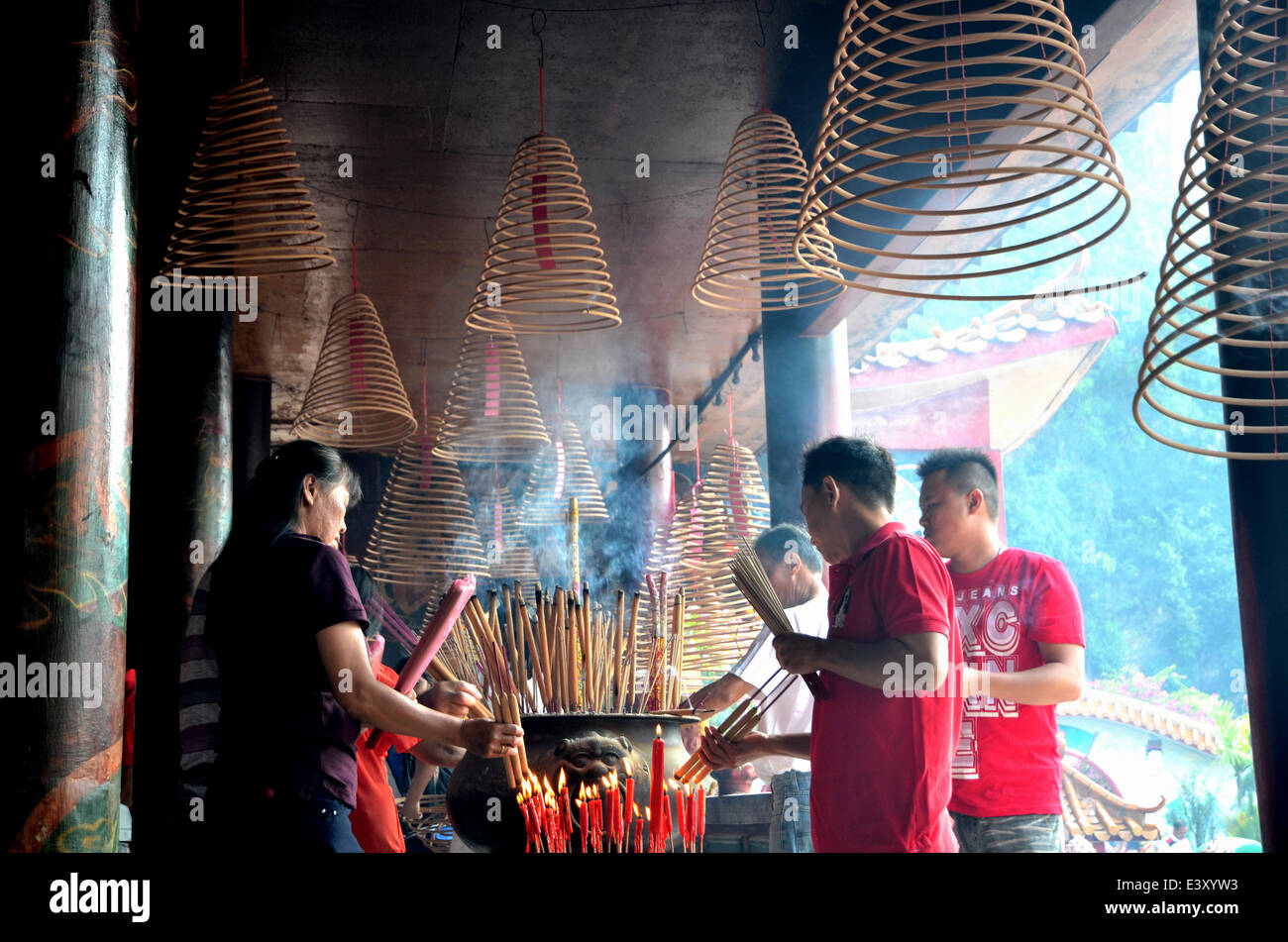 Women in taoist temple hi-res stock photography and images - Alamy