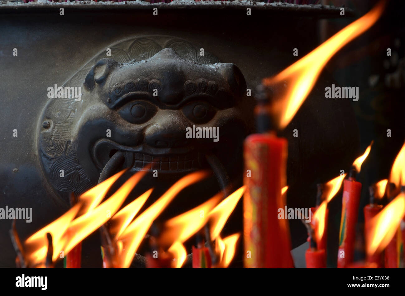 Traditional Chinese red candles burning during religious festival Stock