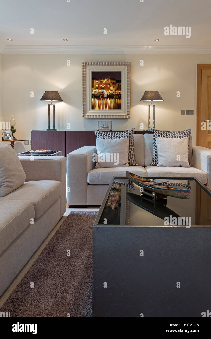 Sofas and coffee table in modern living room Stock Photo - Alamy