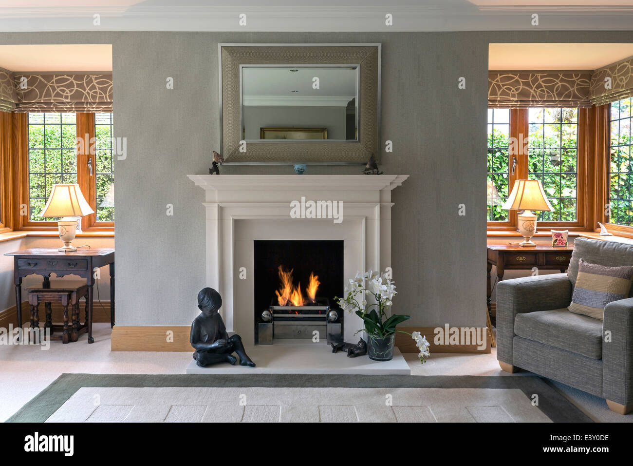 Fireplace and armchair living room Stock Photo