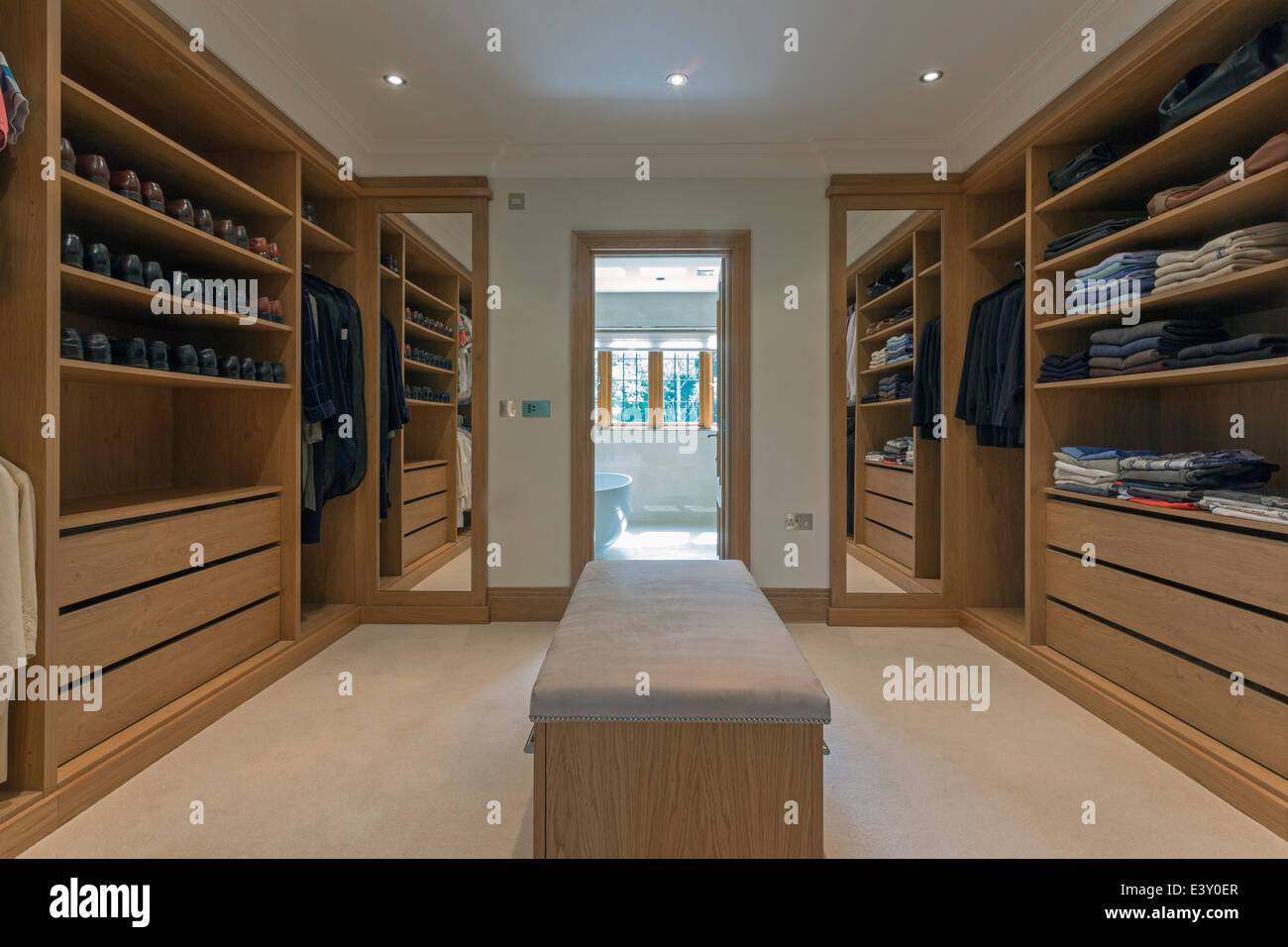 Bench and shelves in walk in closet Stock Photo Alamy