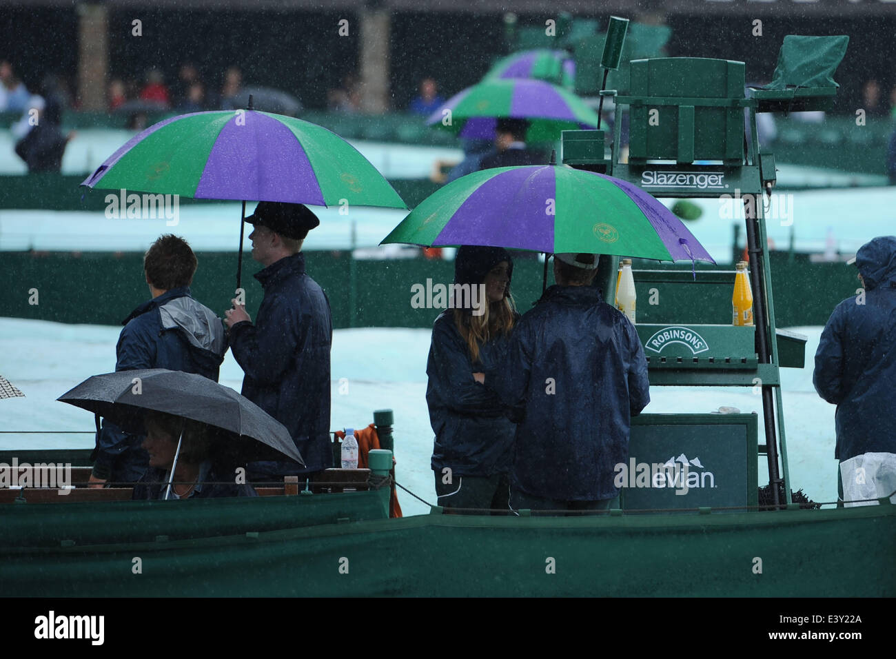 28.06.2014. Wimbledon, London England, Day 6 of the Wimbledon AELTC champions. Rain stops play as the staff and spectators cover up. Stock Photo