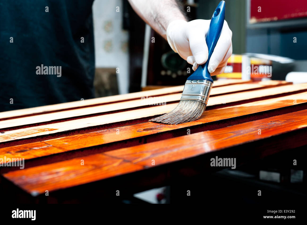Varnishing wooden boards Stock Photo